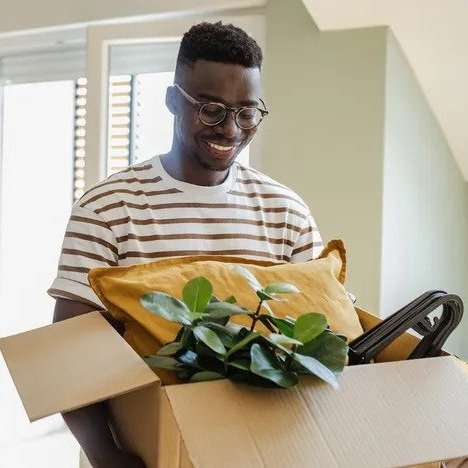 man-opening-a-box Man opening a moving box
